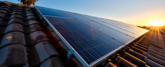 Rooftop solar panels in Arizona soaking up intense summer sun—learn heat-proof tips in the June Survival Guide by Sun Energy Today.