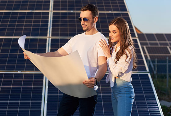 Smiling couple planning to go solar