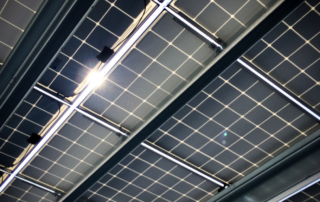 Close-up of solar panels installed on a commercial property in Arizona, illustrating how businesses are investing in solar power in 2025 to slash energy bills, tap federal and state incentives, and increase operational resilience.