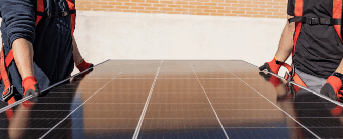 Sun Energy Today Arizona solar installers carrying solar panel for home installation, helping homeowners harness abundant sunshine for energy savings in 2025