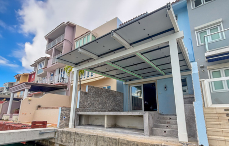 Sun Energy Today Infinity Rack solar canopy installation on waterfront residential property, providing shade and renewable energy. Sun Energy Today Infinity Rack solar canopy installation on waterfront residential property, providing shade and renewable energy.