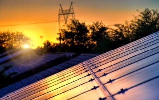 Arizona commercial solar panels at sunset helping reduce grid demand and improve long-term solar energy savings