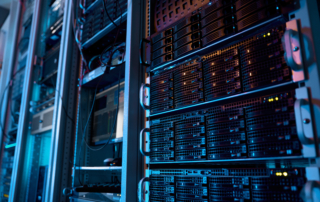 Server racks inside a modern data center supporting AI infrastructure and highlighting the need for data center solar energy storage.